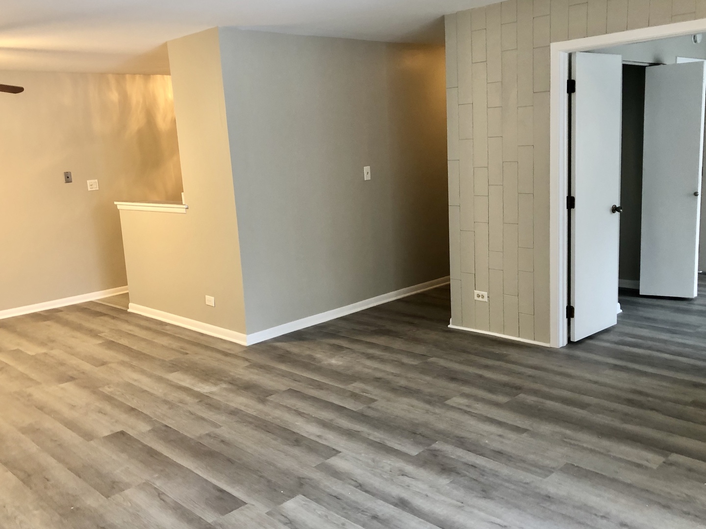 1769 Raleigh Lane Hoffman Estates, IL 60169 - Photo 6 of 17 an empty room with wooden floor and windows