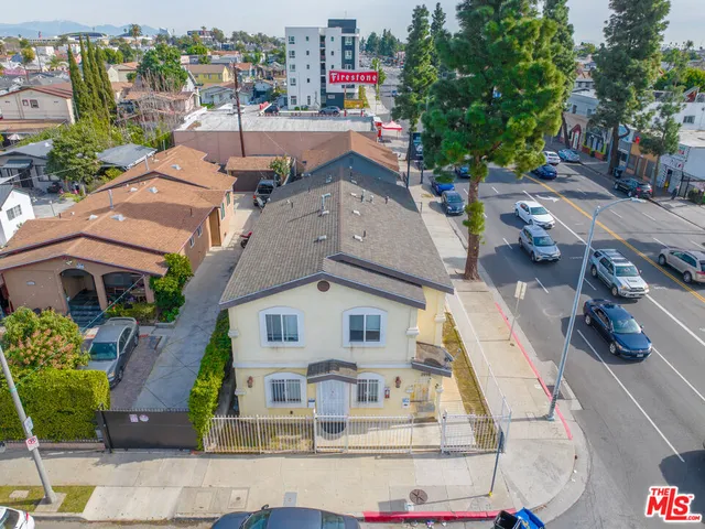 an aerial view of a house with outdoor space