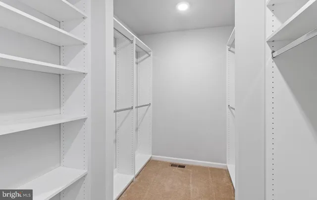 a bathroom with a sink vanity and a mirror