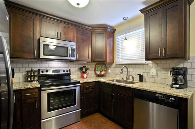 Kitchen has tile backsplash and deep undermount sink! Also, has an appliance garage