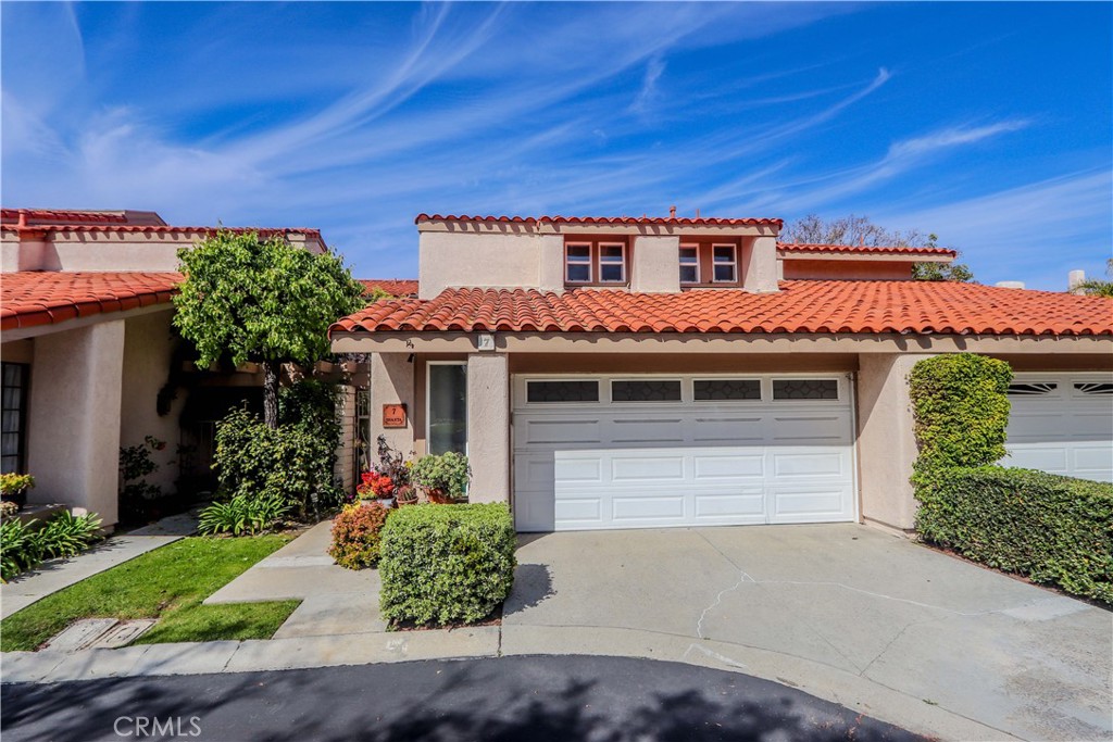 a front view of a house with a garage