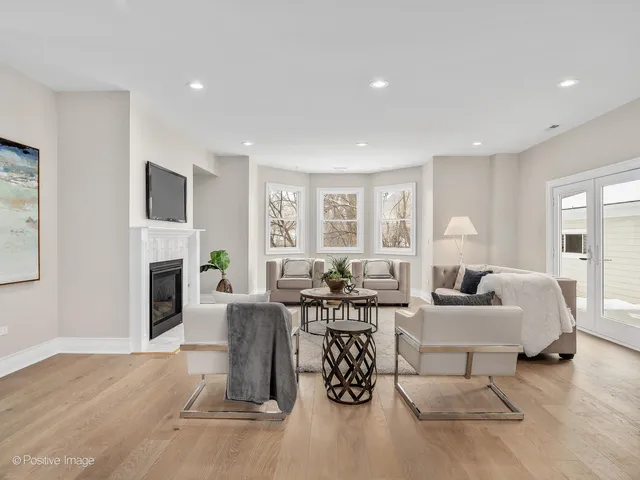 a living room with fireplace furniture and a fireplace