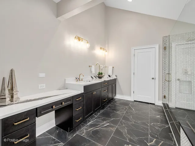 a spacious bathroom with a double vanity sink and a mirror