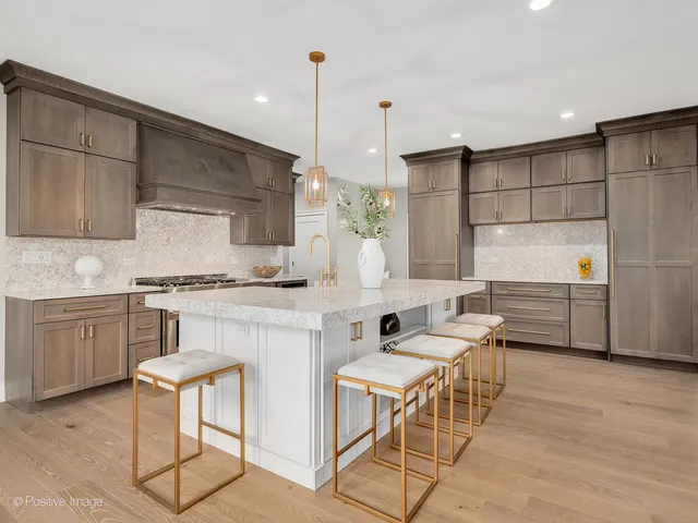 a kitchen with a sink cabinets and window