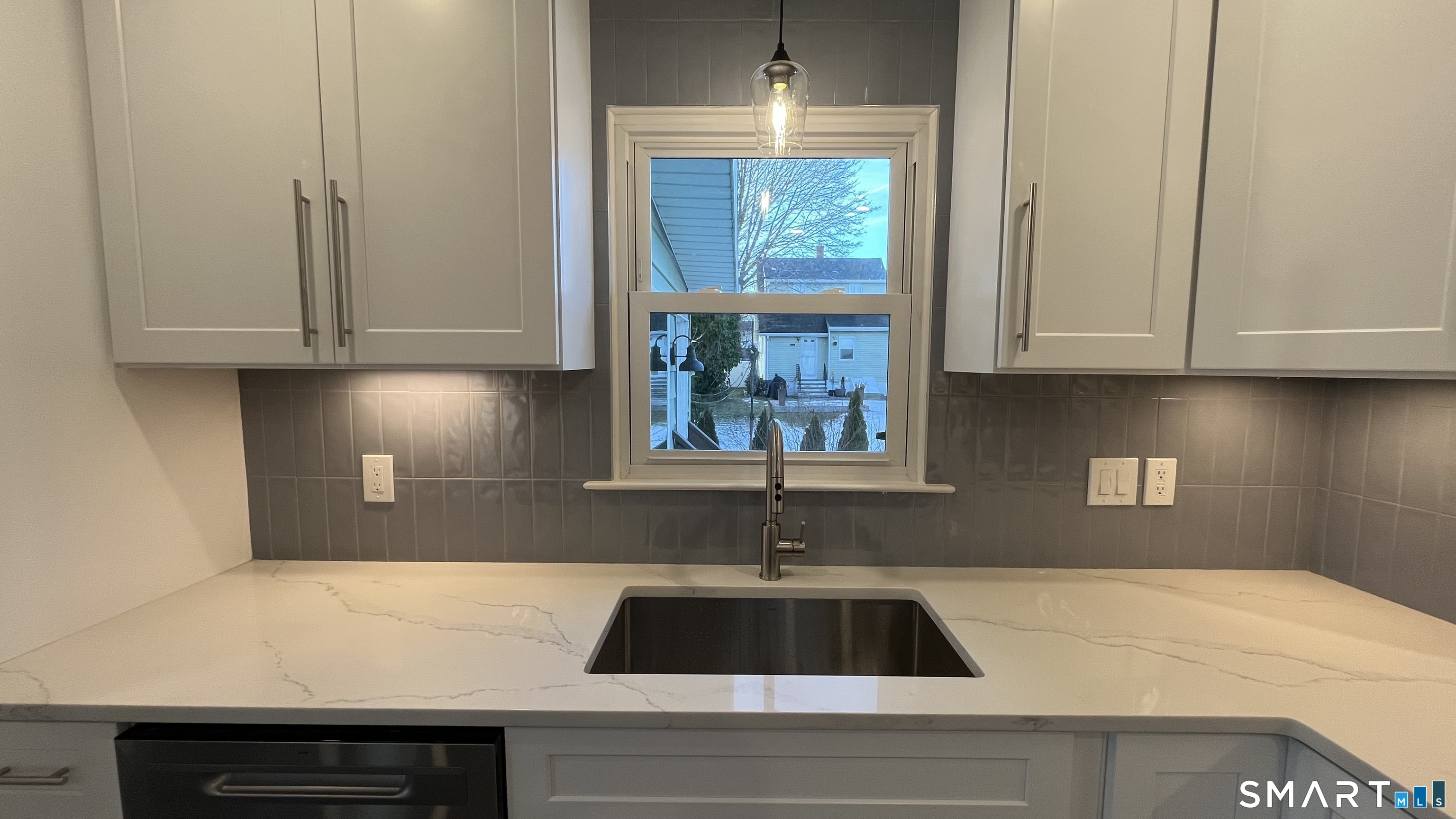 34 Keith Street, Unit 2 Stamford, CT 06902 - Photo 3 of 15 a kitchen with a sink and cabinets