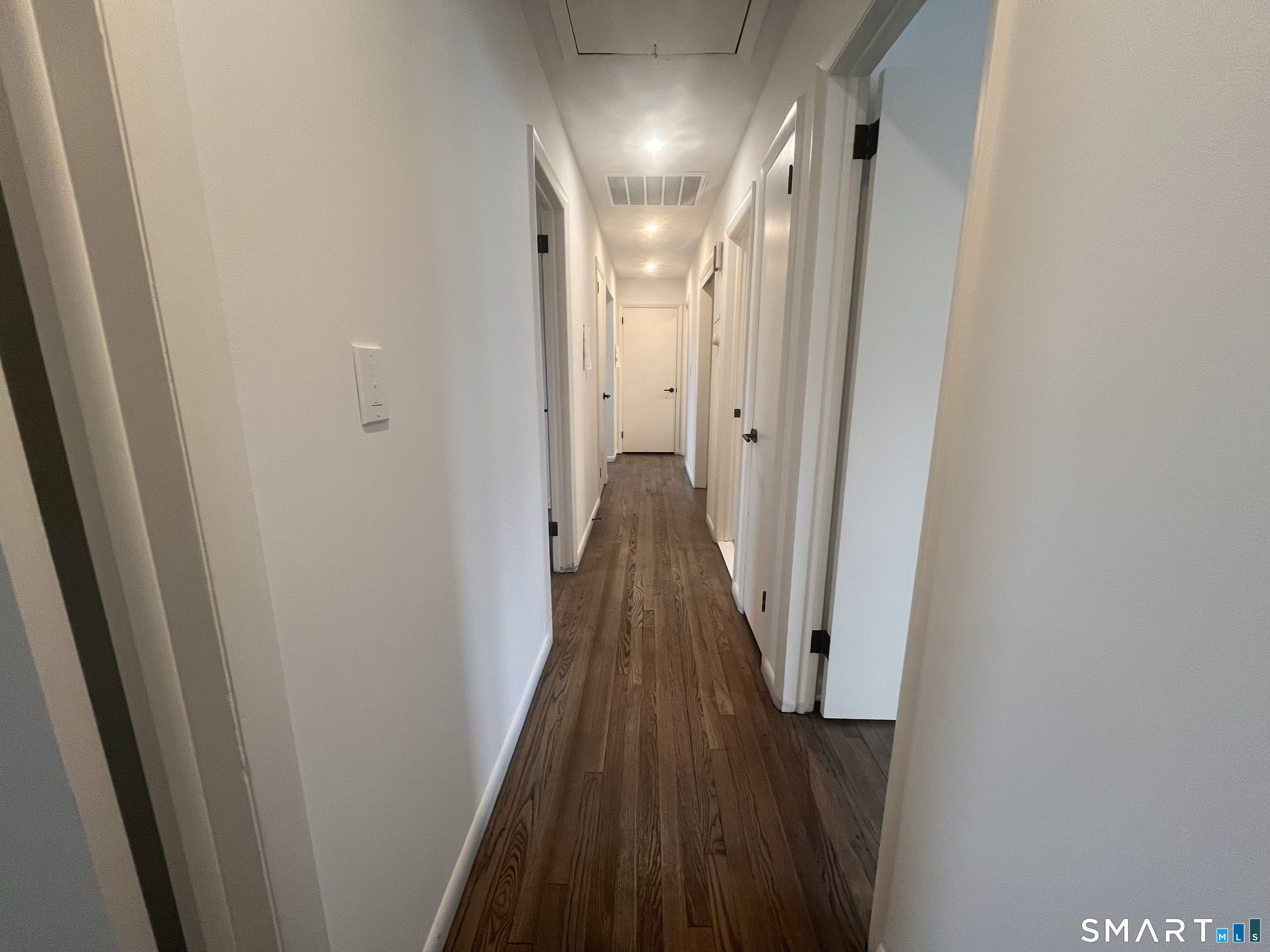 34 Keith Street, Unit 2 Stamford, CT 06902 - Photo 9 of 15 a view of a hallway with wooden floor