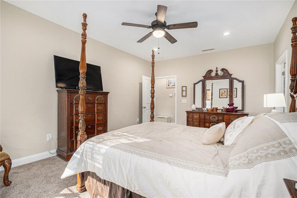 85 Jane Harris Road Dallas, GA 30157 - Photo 16 of 33 a bedroom with a bed and a flat screen tv