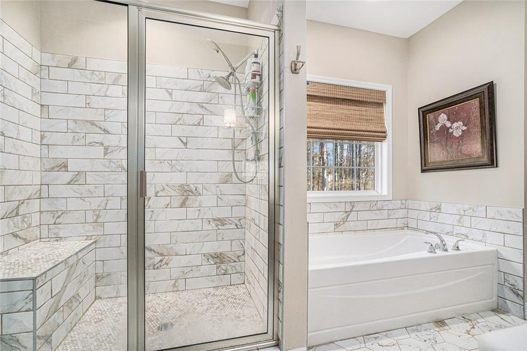 85 Jane Harris Road Dallas, GA 30157 - Photo 18 of 33 a bathroom with a bathtub and shower