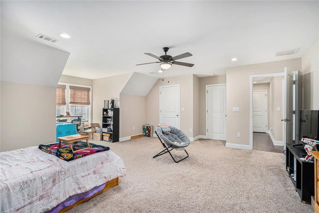 85 Jane Harris Road Dallas, GA 30157 - Photo 20 of 33 a bedroom with bed and ceiling fan