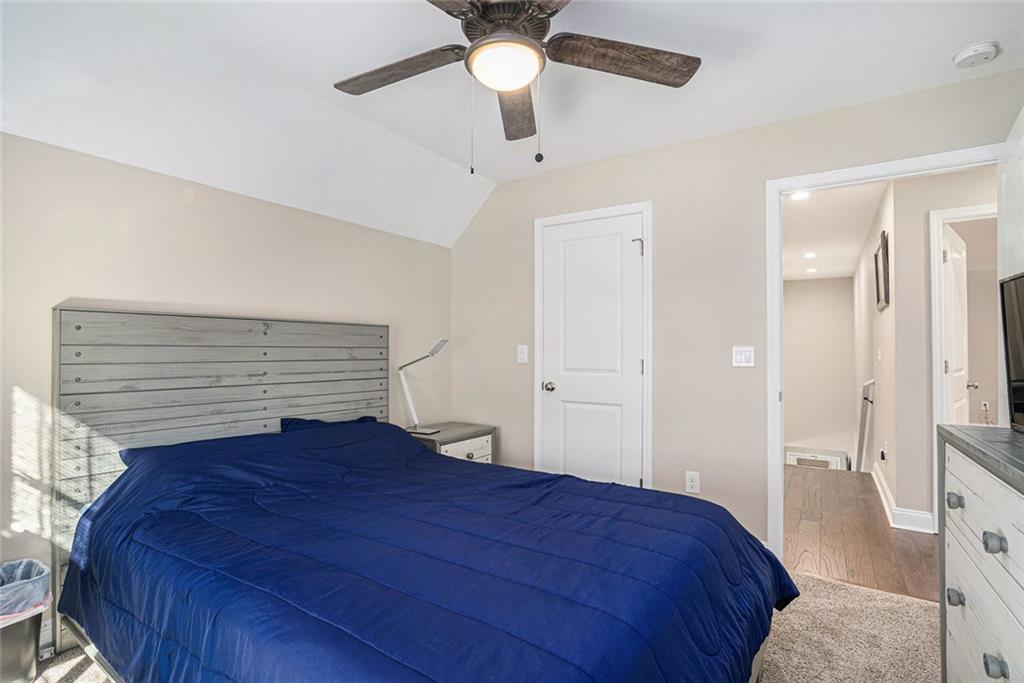 85 Jane Harris Road Dallas, GA 30157 - Photo 24 of 33 a bedroom with a bed and a ceiling fan