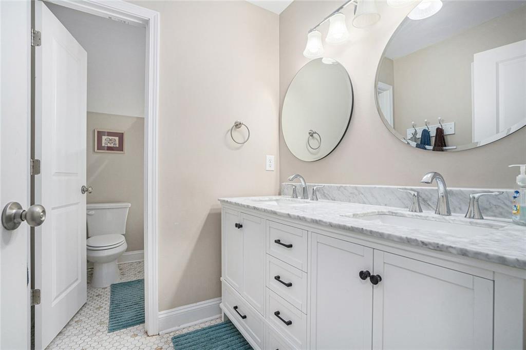 85 Jane Harris Road Dallas, GA 30157 - Photo 26 of 33 a bathroom with a granite countertop sink mirror and toilet