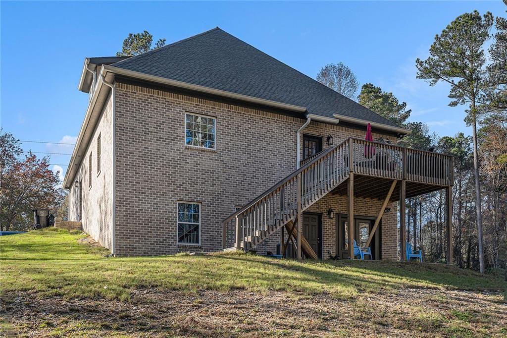 85 Jane Harris Road Dallas, GA 30157 - Photo 32 of 33 a backyard of a house with wooden fence