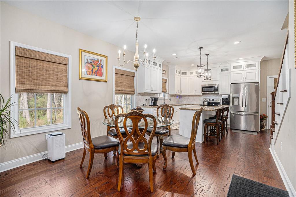 85 Jane Harris Road Dallas, GA 30157 - Photo 7 of 33 a view of a dining room with furniture window and wooden floor