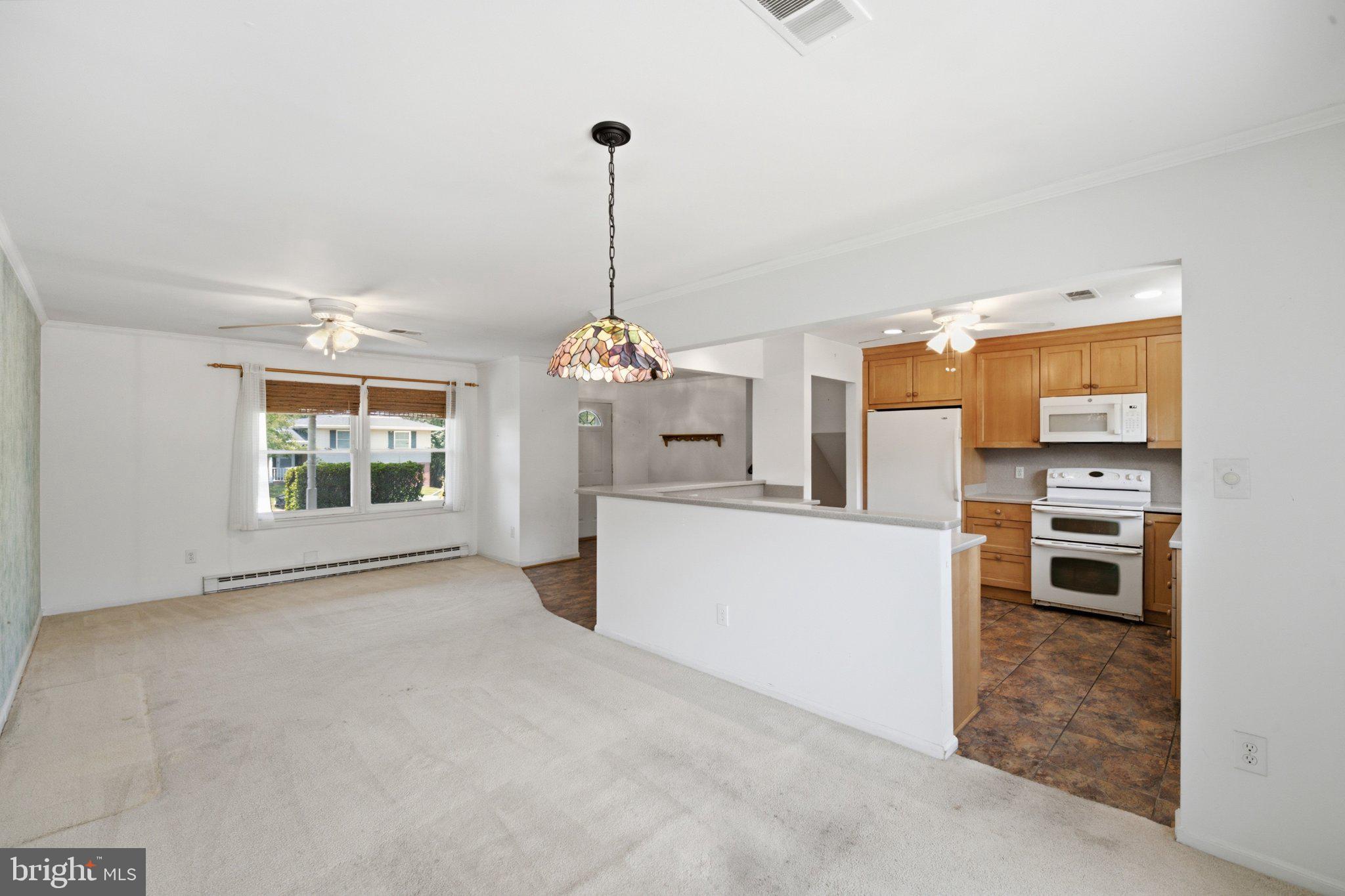 1206 East Iberia Road Sterling, VA 20164 - Photo 7 of 48 Dining flows to living room and into kitchen.
