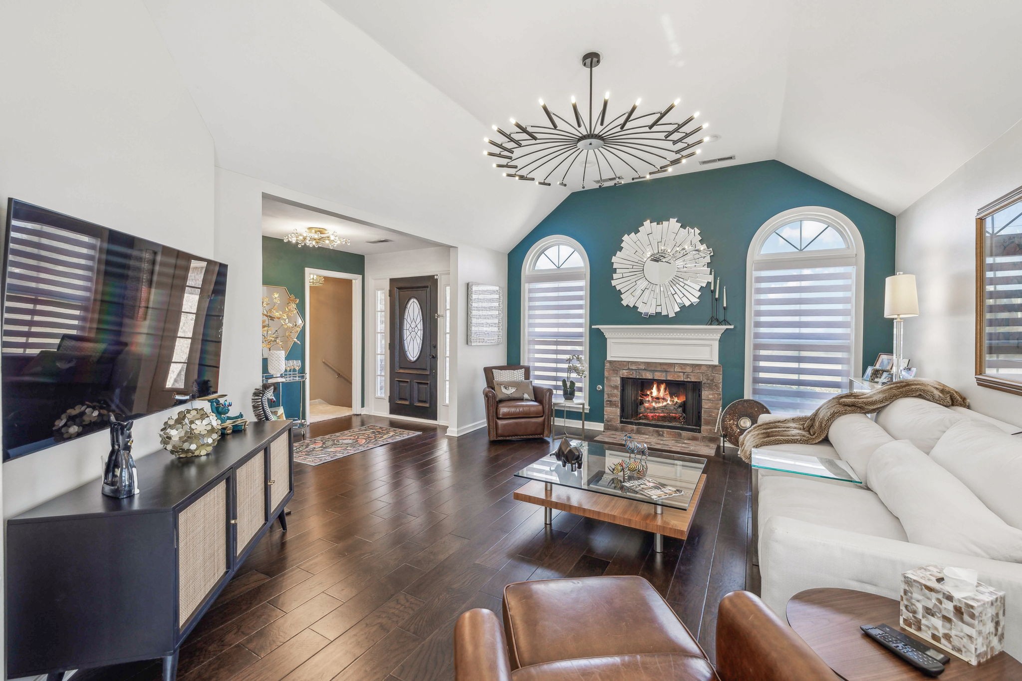 3920 Kedron Road Spring Hill, TN 37174 - Photo 13 of 40 a living room with furniture a fireplace and a flat screen tv
