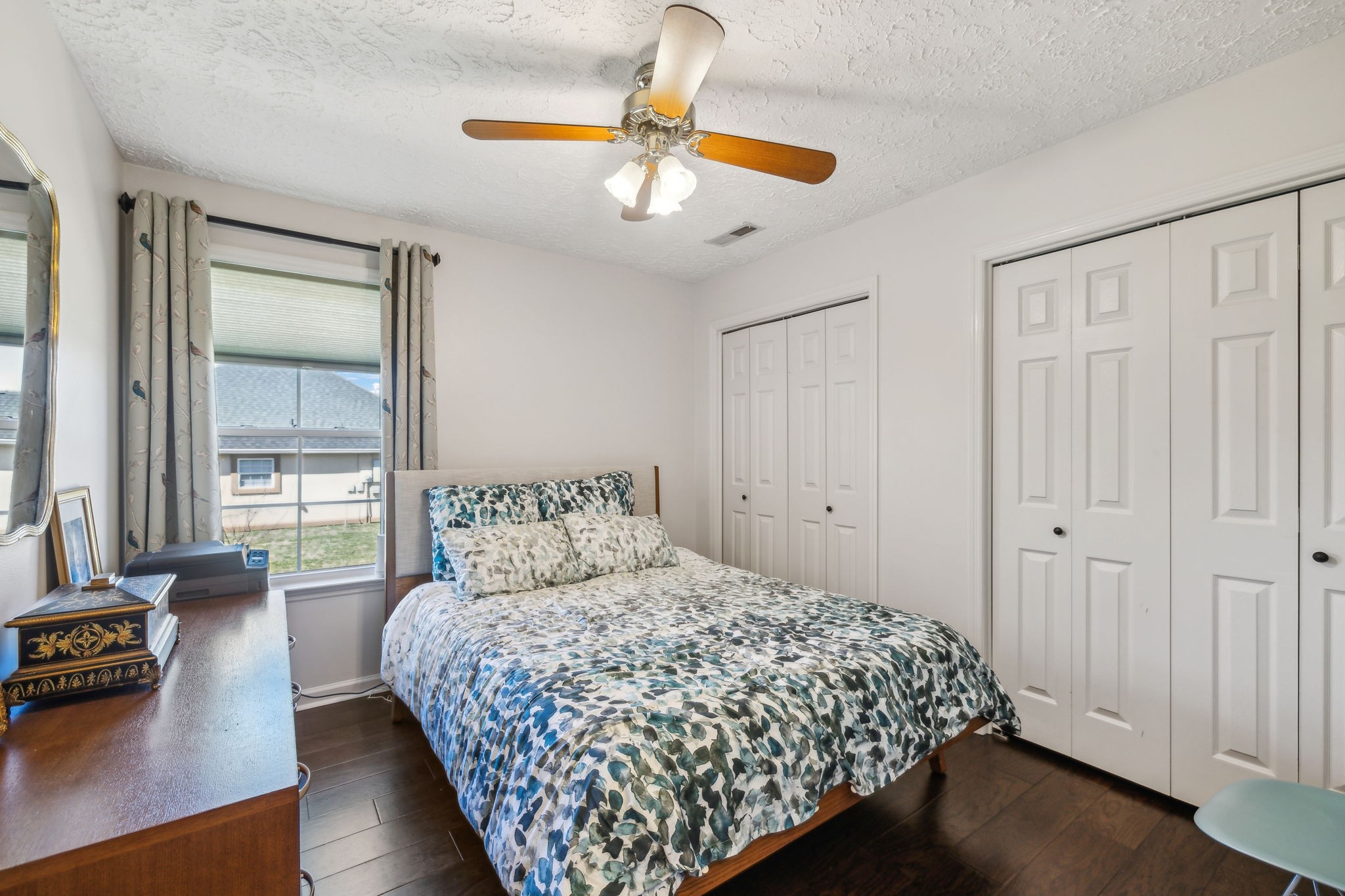 3920 Kedron Road Spring Hill, TN 37174 - Photo 27 of 40 a bedroom with a large bed and a chandelier