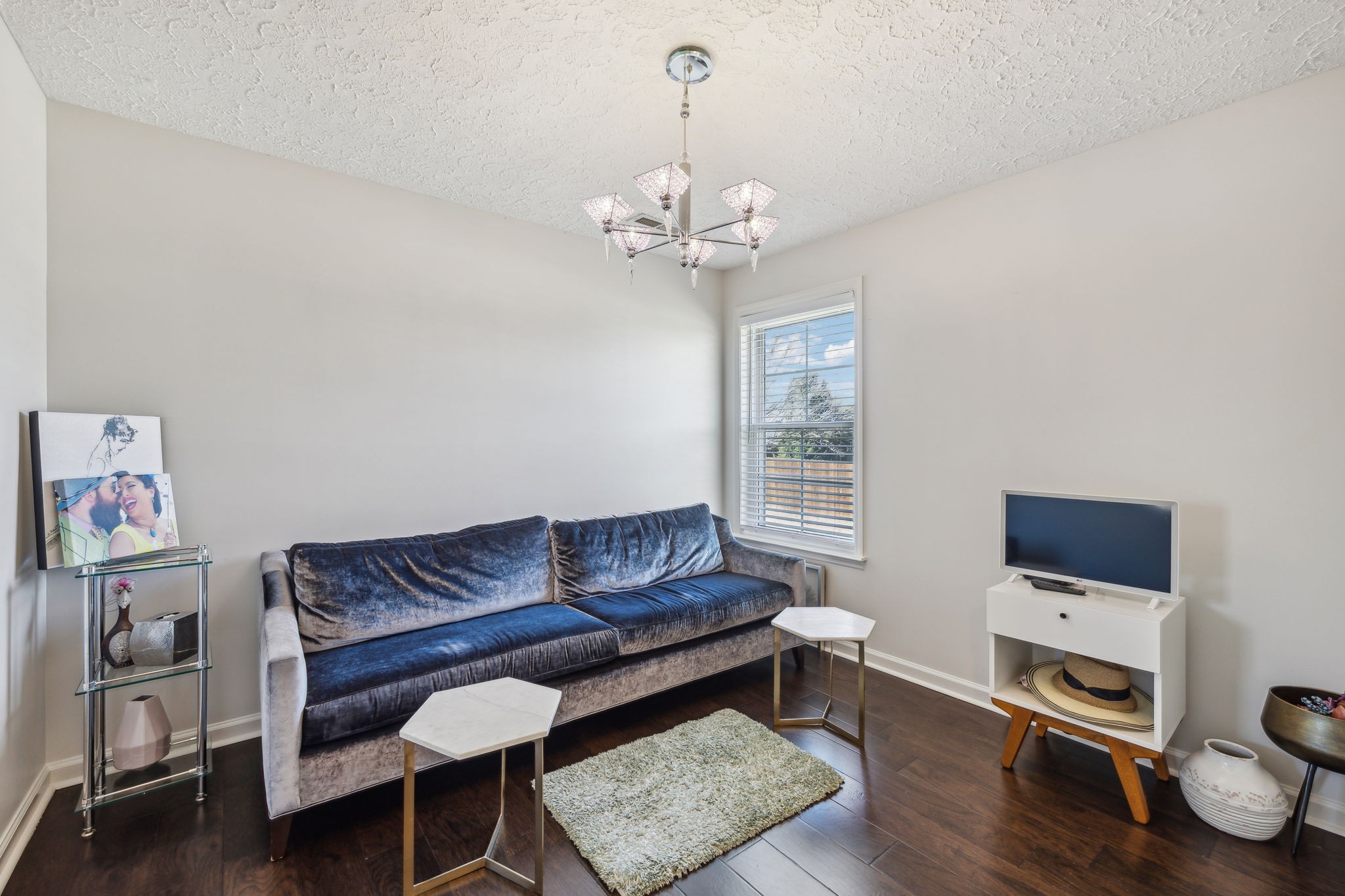 3920 Kedron Road Spring Hill, TN 37174 - Photo 28 of 40 a living room with furniture a flat screen tv and a window