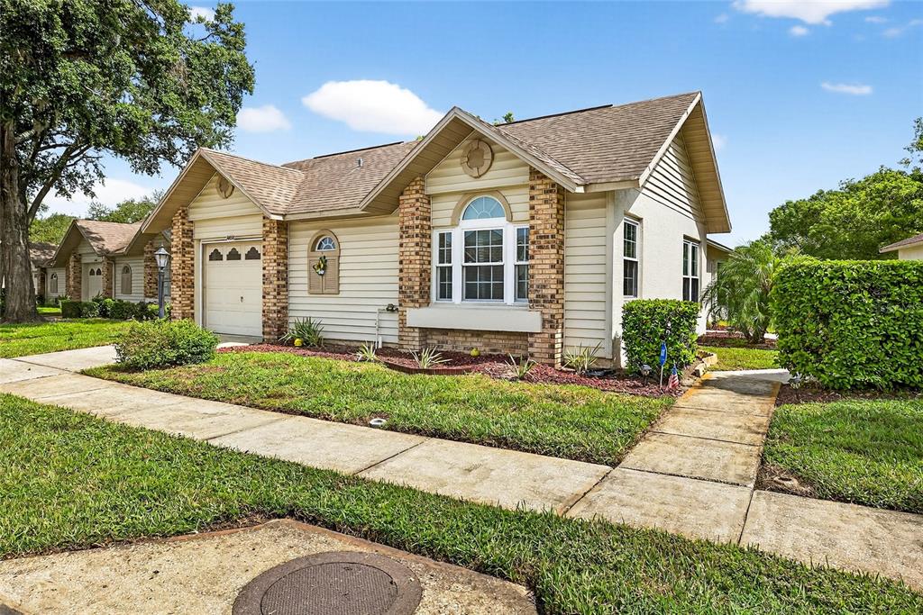 4658 Wallingford Court New Port Richey, FL 34655 - Photo 2 of 48 a view of a yard in front view of a house