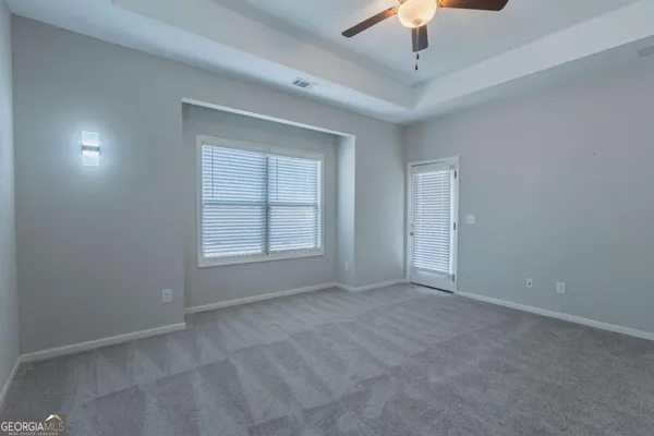 a view of an empty room with a window