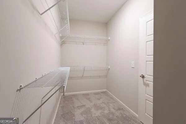 a large bathroom with a sink a mirror and a bathtub