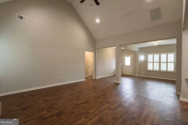 a view of kitchen with sink and wooden floor
