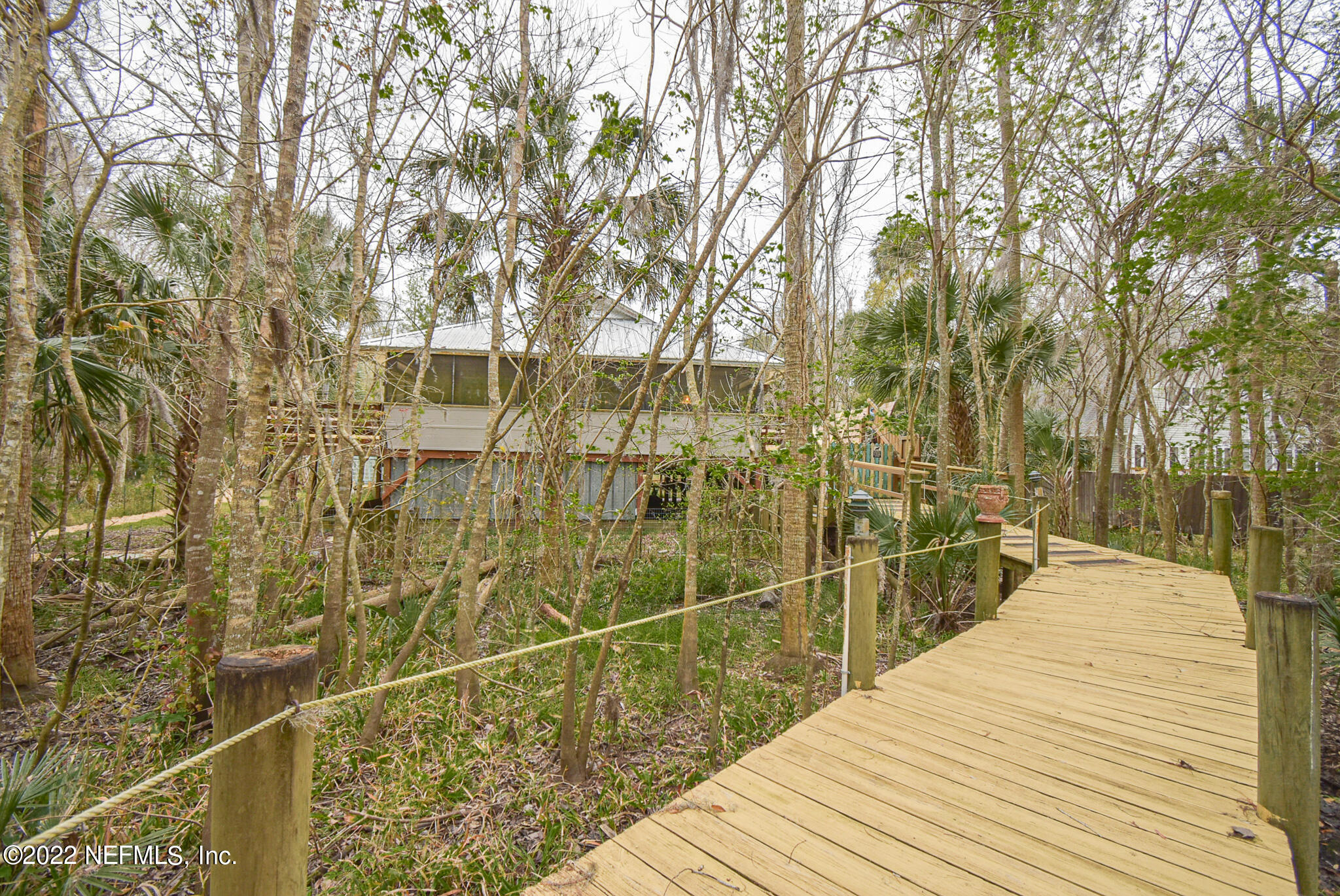 566 Clifton Road Crescent City, FL 32112 - Photo 12 of 41 a view of a balcony with wooden floor and fence