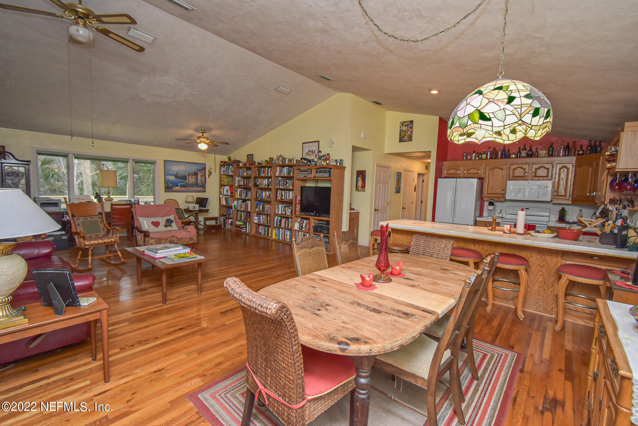 566 Clifton Road Crescent City, FL 32112 - Photo 18 of 41 a outdoor dining space with furniture and view of kitchen