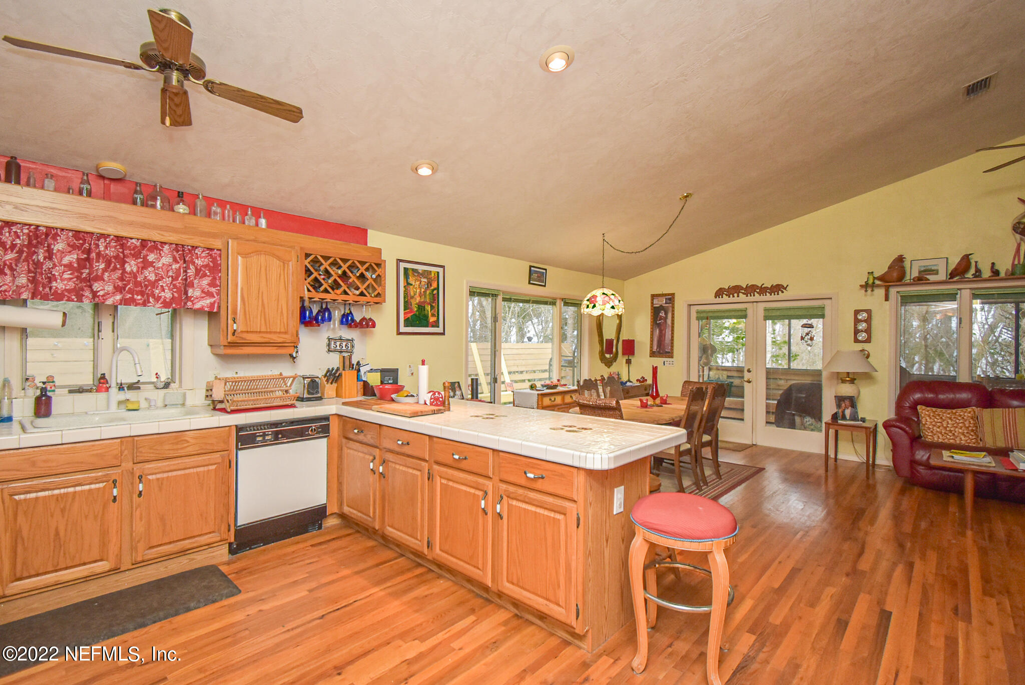 566 Clifton Road Crescent City, FL 32112 - Photo 20 of 41 a kitchen with a sink stove and wooden cabinets