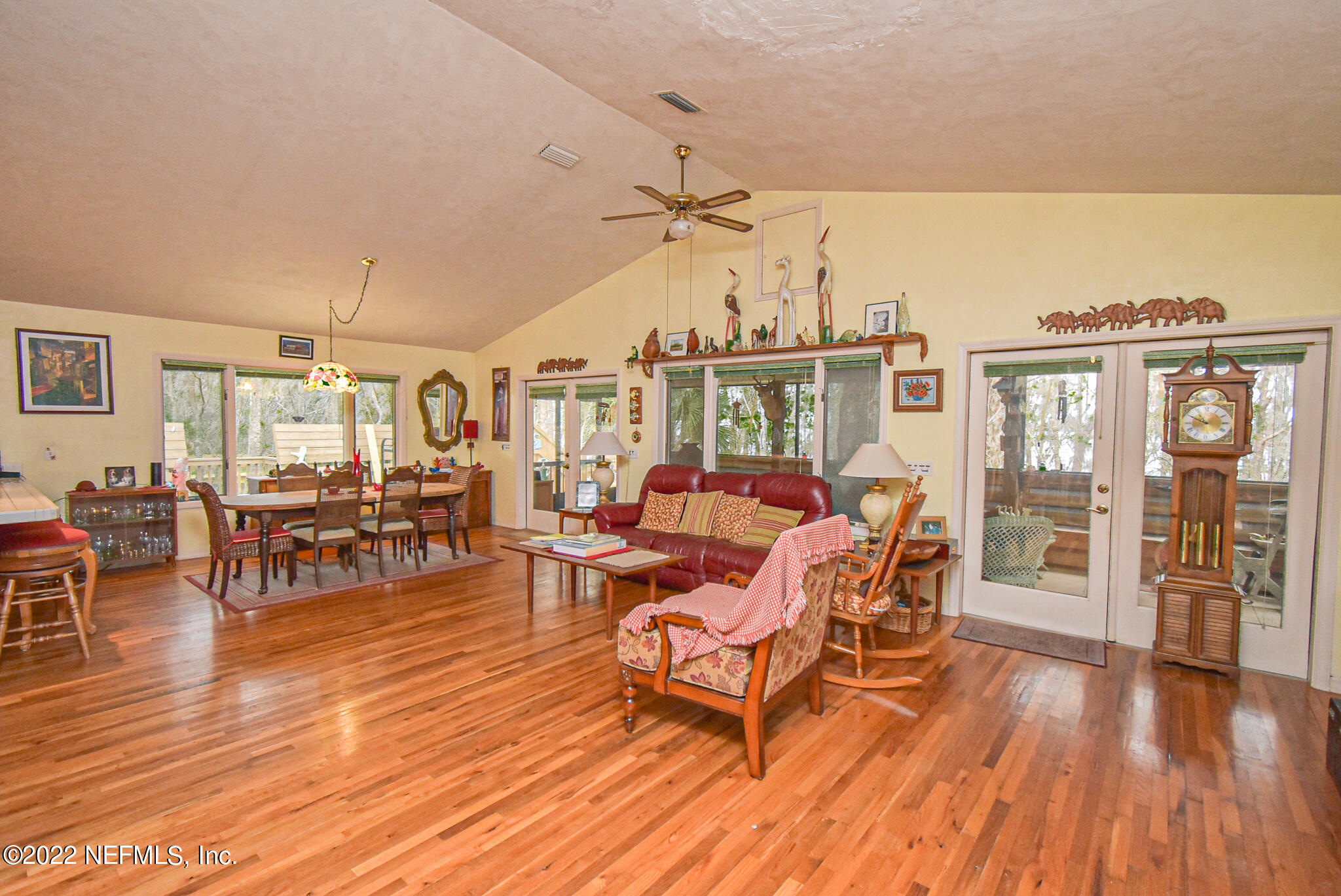 566 Clifton Road Crescent City, FL 32112 - Photo 21 of 41 a living room with furniture a wooden floor and next to a window