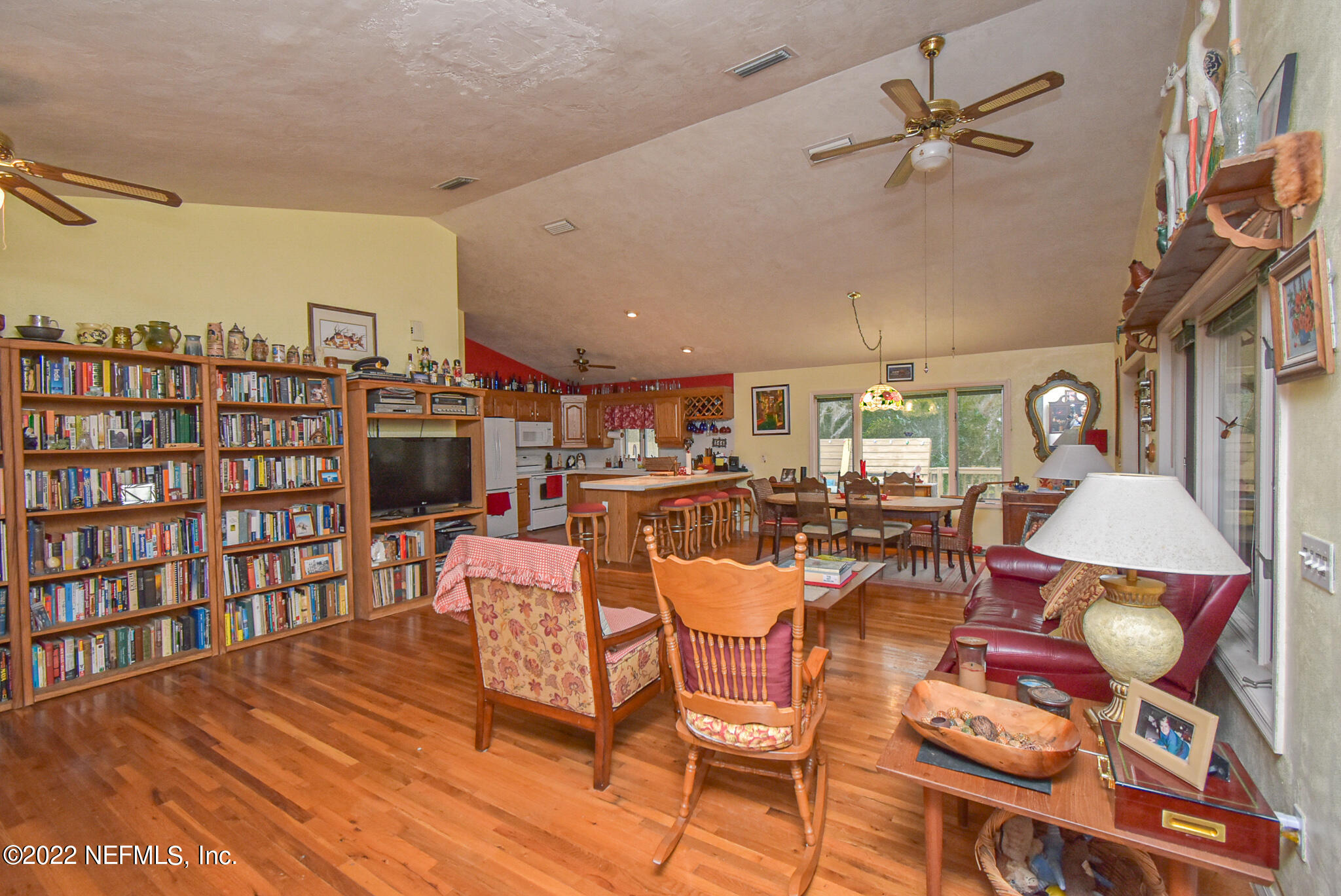 566 Clifton Road Crescent City, FL 32112 - Photo 22 of 41 a view of a dining room with furniture window and wooden floor