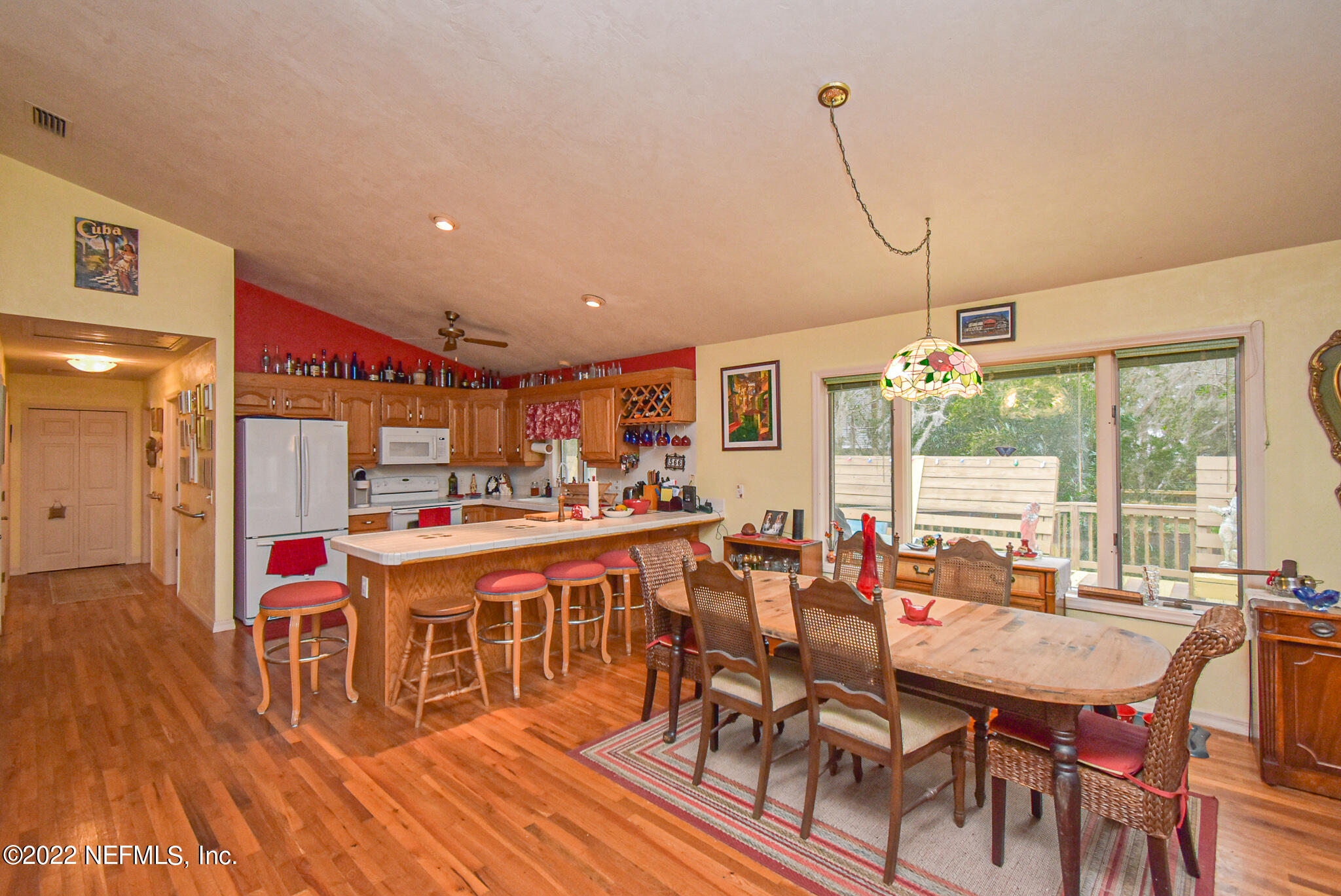 566 Clifton Road Crescent City, FL 32112 - Photo 23 of 41 a outdoor dining space with furniture and wooden floor