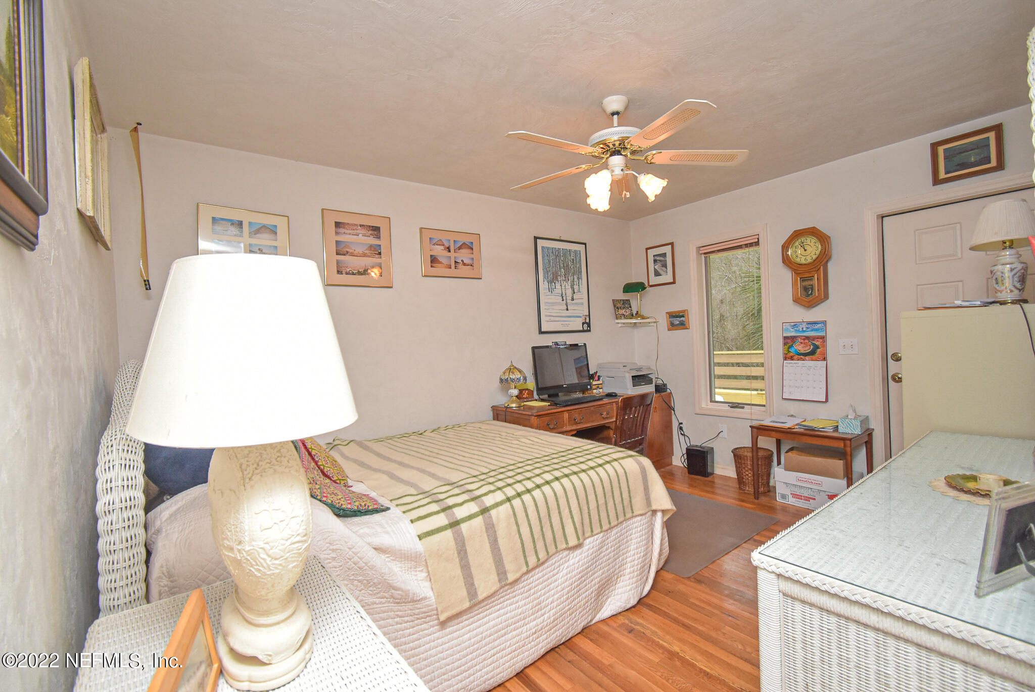 566 Clifton Road Crescent City, FL 32112 - Photo 29 of 41 a bedroom with a bed and wooden floor