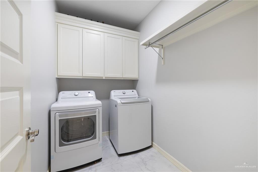 1422 South Esperanza Street Pharr, TX 78577 - Photo 15 of 16 a utility room with dryer and washer