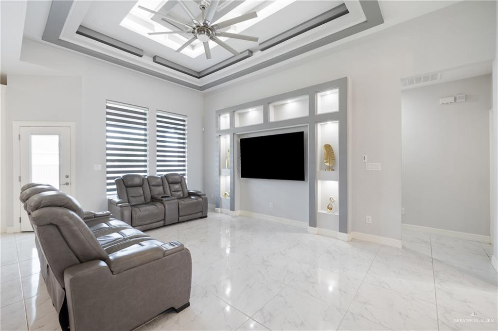 1422 South Esperanza Street Pharr, TX 78577 - Photo 2 of 16 a living room with furniture and a flat screen tv