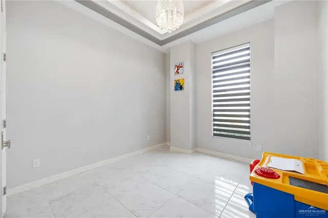 a view of room with window and a ceiling fan