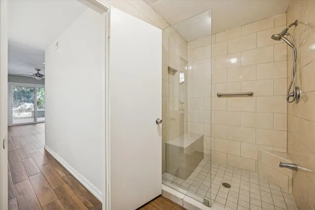 a bathroom with a glass shower door