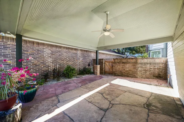 a view of a porch with a potted plant