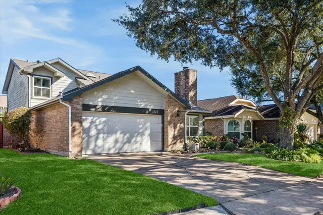 a front view of house with garden