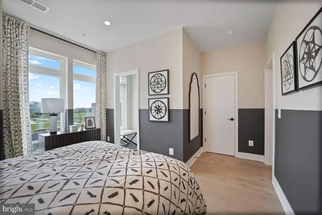 a view of walk in closet with clothes