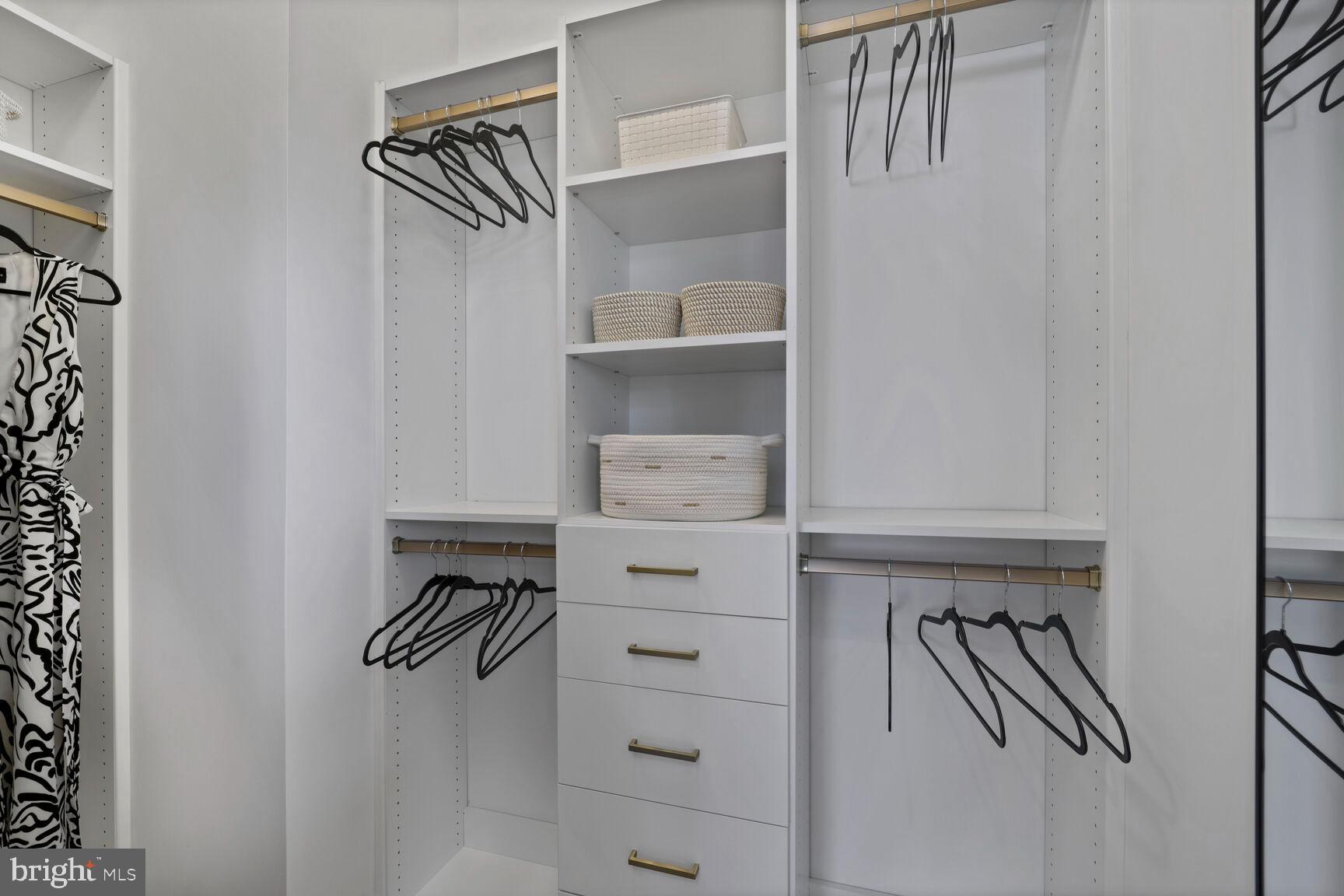 61 Lower Service Road Northwest, Unit HOMESITE 908 Washington, DC 20422 - Photo 15 of 22 a view of walk in closet with clothes