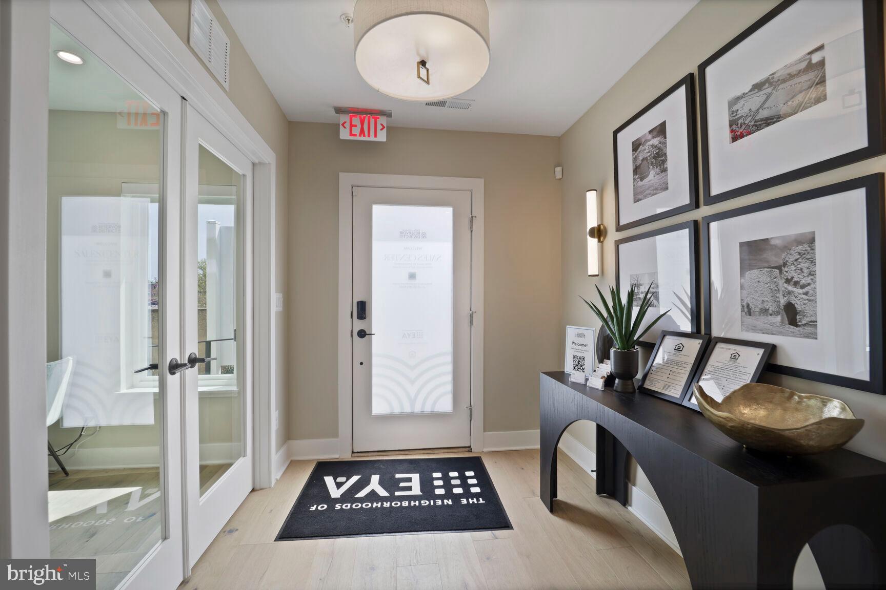 61 Lower Service Road Northwest, Unit HOMESITE 908 Washington, DC 20422 - Photo 16 of 22 a view of a hallway and a livingroom with furniture