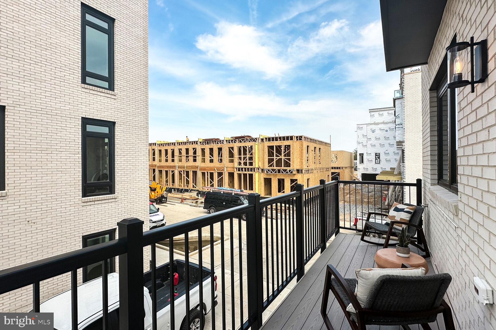 61 Lower Service Road Northwest, Unit HOMESITE 908 Washington, DC 20422 - Photo 4 of 22 a view of a balcony with chairs