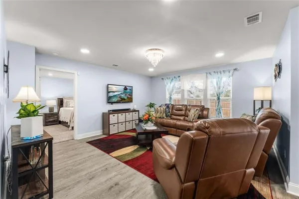 a living room with furniture and a table