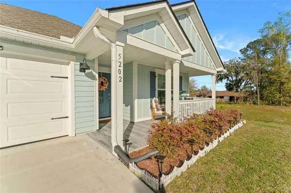a view of a balcony with chairs