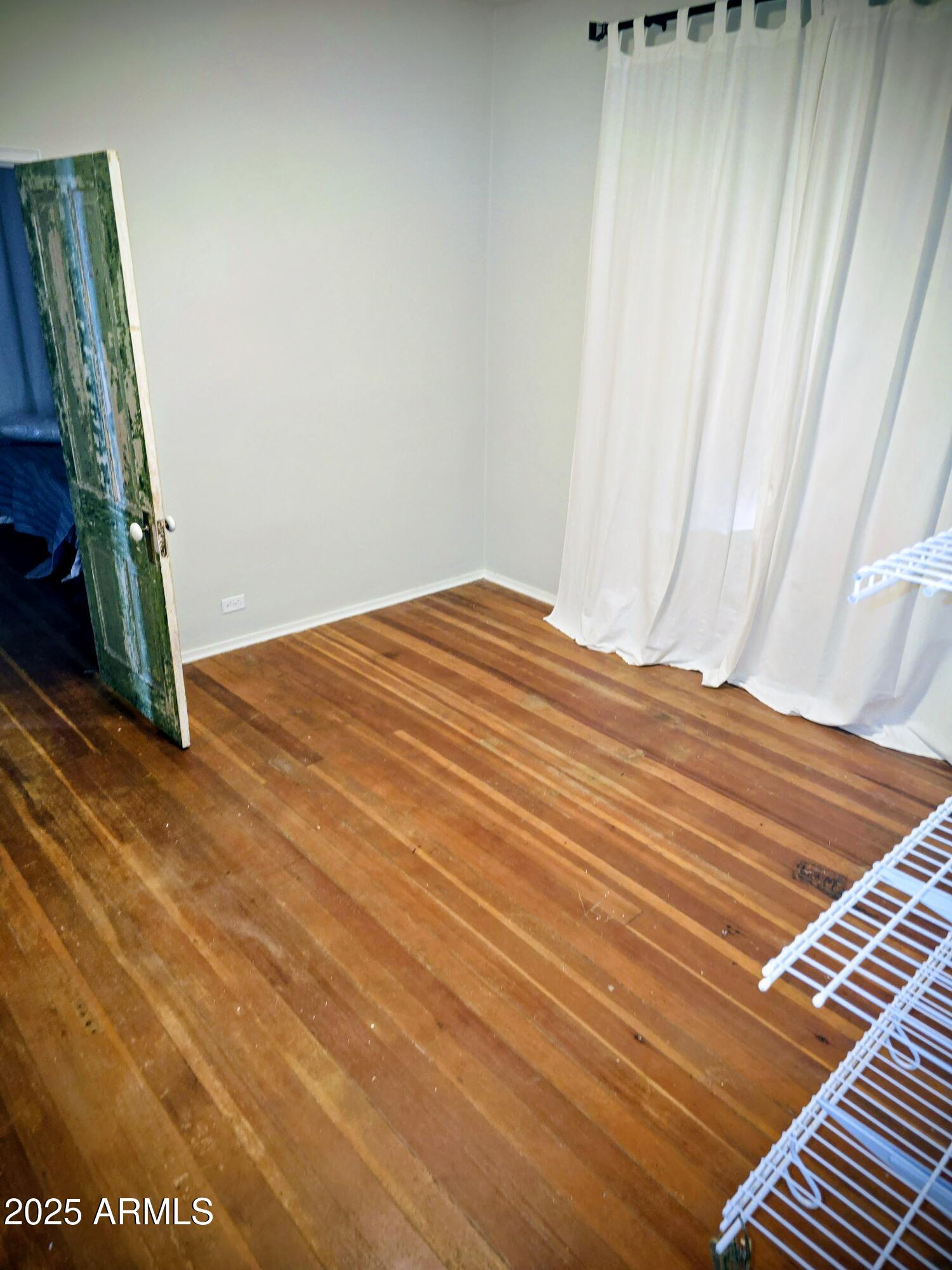 110 Arizona Street Bisbee, AZ 85603 - Photo 12 of 25 a view of a room with wooden floor and stairs