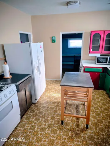 a living room with a couch and a stove top oven