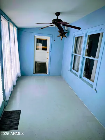a view of an empty room with a window