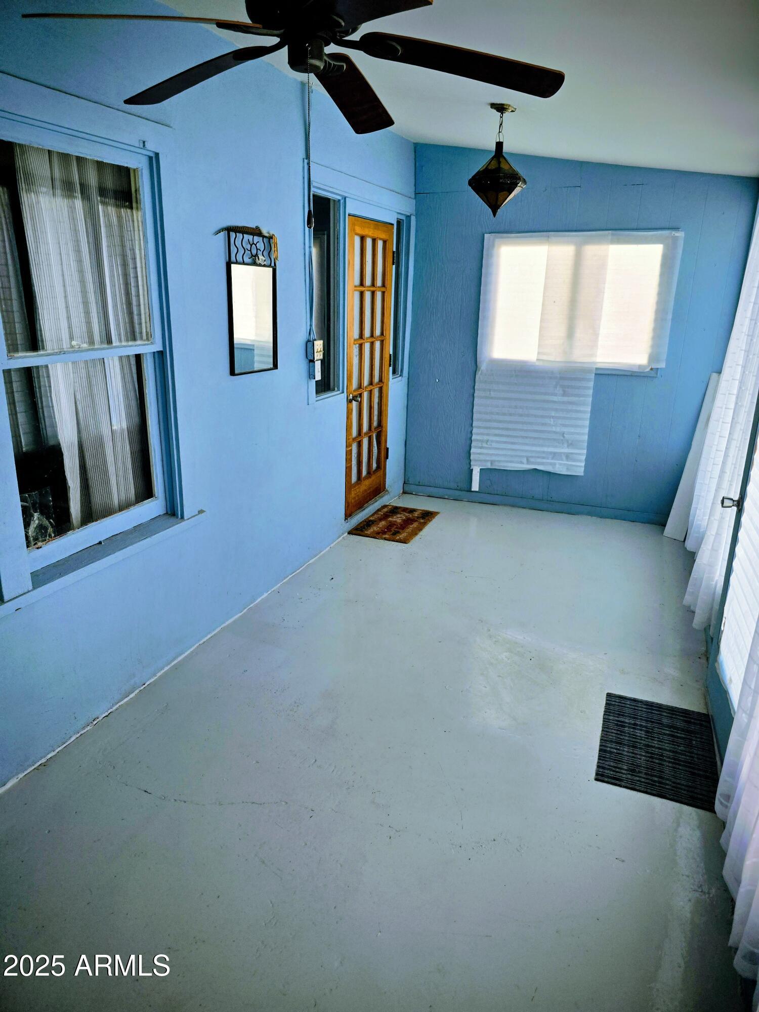 110 Arizona Street Bisbee, AZ 85603 - Photo 25 of 25 an empty room with windows