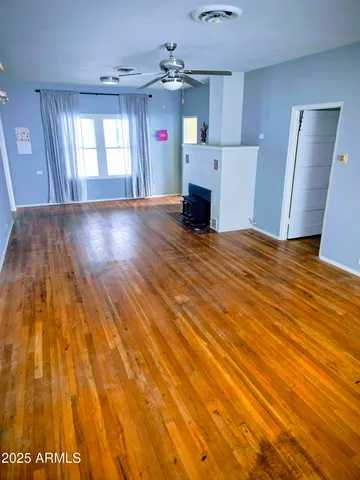 a view of a livingroom with furniture and a kitchen