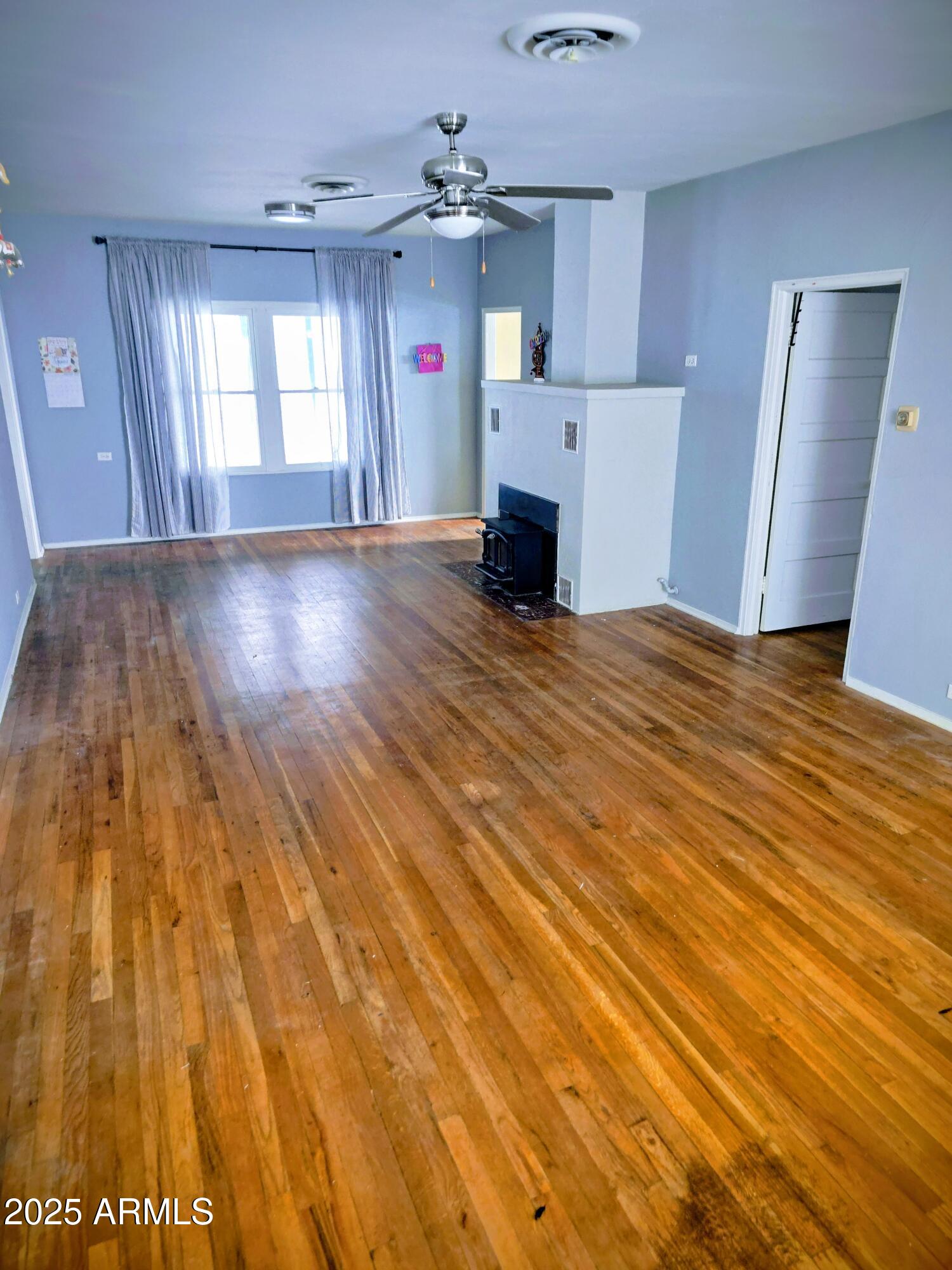 110 Arizona Street Bisbee, AZ 85603 - Photo 7 of 25 a view of a livingroom with furniture and a kitchen